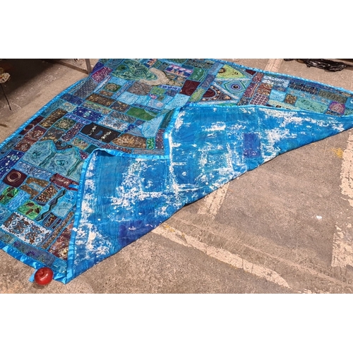 796 - Handcrafted patchwork quilt with vibrant blue and turquoise panels. Detailed with intricate embroide... 