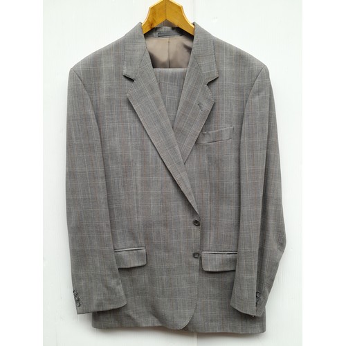 980 - A pure wool mens suit from Arnotts including a jacket and trousers, size Large. Comes with storage b... 