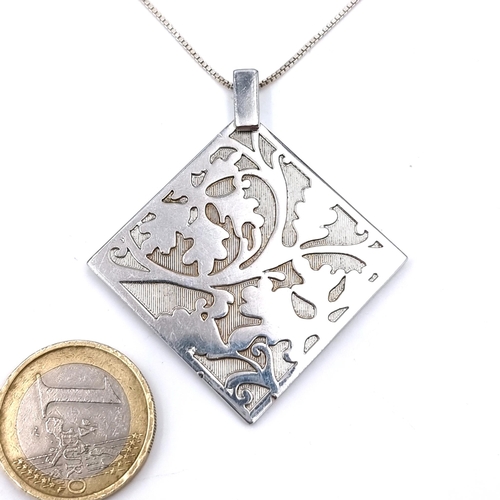 1020 - An unusual Sterling Silver Pendant and Chain with lobster clasp. Both stamped 925. Boxed.
Total Leng... 