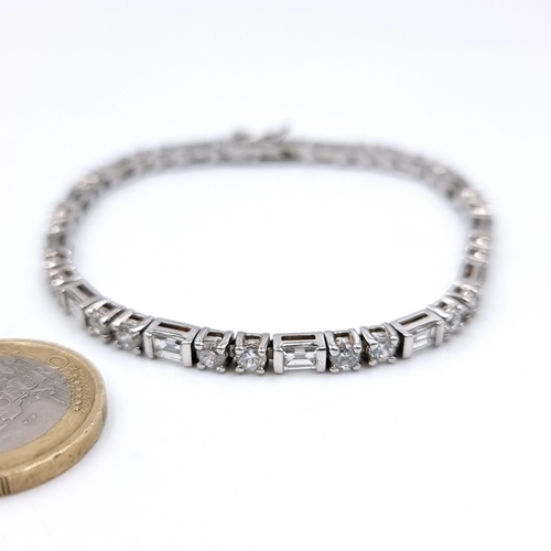 1027 - A sterling silver 925 diamante tennis bracelet. Boxed.
Total Weight: 12.92 grams