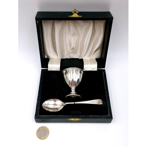 987 - A sterling silver Egg and spoon set with hallmarks for Birmingham dating to 1966. Housed in original... 