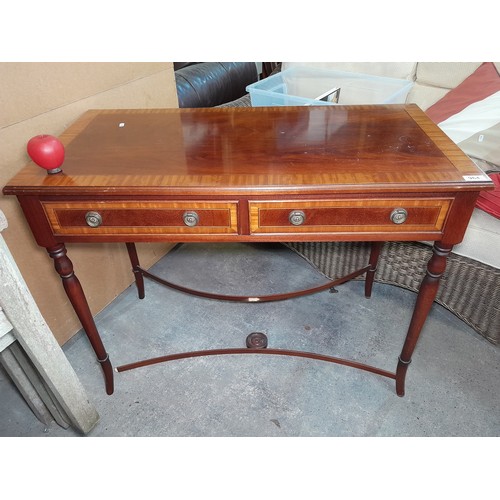 964 - An elegant Edwardian style console table featuring two pullout drawers to the front with brass ring ... 