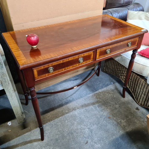 964 - An elegant Edwardian style console table featuring two pullout drawers to the front with brass ring ... 