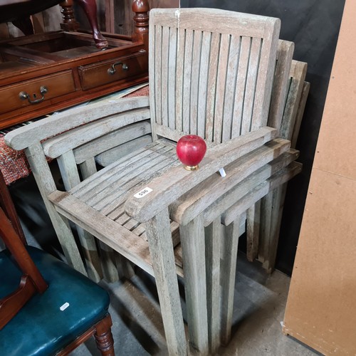 965 - Four wooden  teak stackable patio / garden dining chairs. All in good order no breaks or damage.