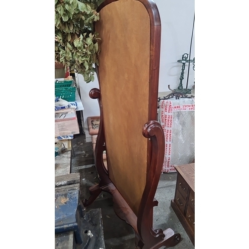 750 - Star Lot: A beautiful Victorian-style mahogany cheval mirror with elegant carved details and a tilti... 