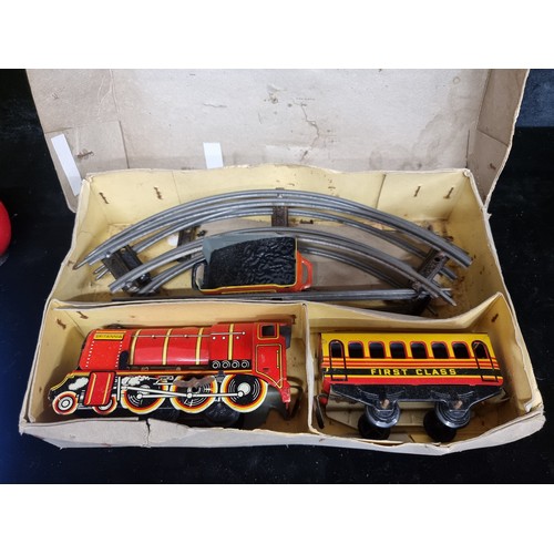 124 - A vintage collector's Brimtoy Brand Mechanical Train Set. British made. In its original packaging.