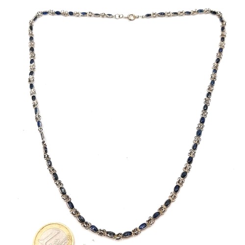 1028 - A very nice example of a long sapphire necklace. Total length 53cm. Total weight 11.94 grams. Housed... 