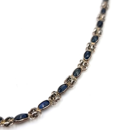 1028 - A very nice example of a long sapphire necklace. Total length 53cm. Total weight 11.94 grams. Housed... 