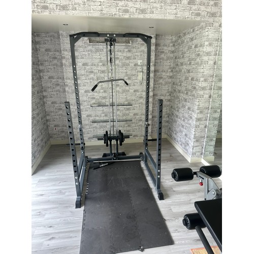 1056 - Star Lot : A very good rack With lat pull down Pegs to hold an Olympic bar and space for a bench the... 