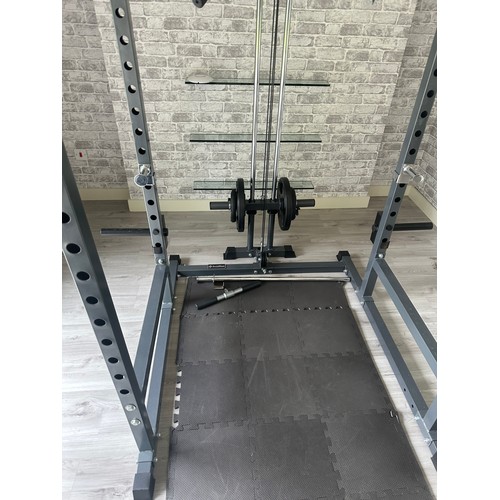 1056 - Star Lot : A very good rack With lat pull down Pegs to hold an Olympic bar and space for a bench the... 