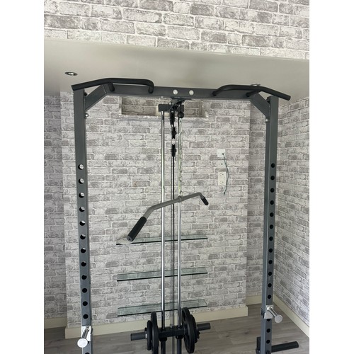 1056 - Star Lot : A very good rack With lat pull down Pegs to hold an Olympic bar and space for a bench the... 