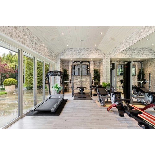 1056 - Star Lot : A very good rack With lat pull down Pegs to hold an Olympic bar and space for a bench the... 