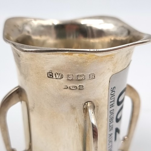 2 - A sterling silver mether mead cup of tapering form,  set with four elongated feet. Hallmarked Birmin... 