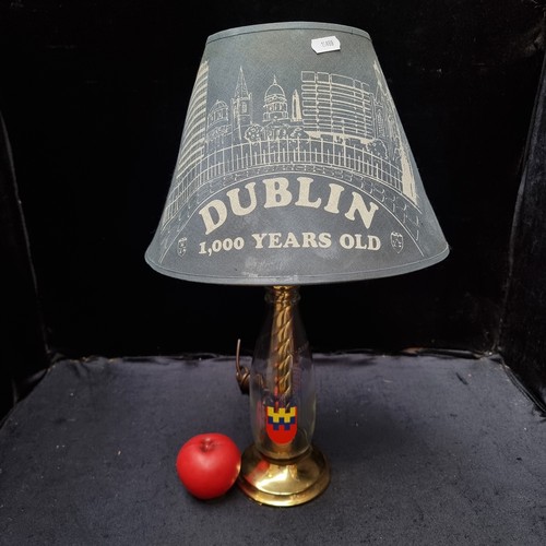 799 - Mixed lot containing a commemorative milk bottle lamp, a plush toy, Dublin millennium T-shirt, comme... 