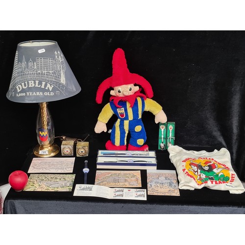 799 - Mixed lot containing a commemorative milk bottle lamp, a plush toy, Dublin millennium T-shirt, comme... 