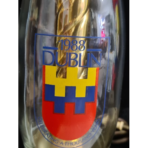 799 - Mixed lot containing a commemorative milk bottle lamp, a plush toy, Dublin millennium T-shirt, comme... 