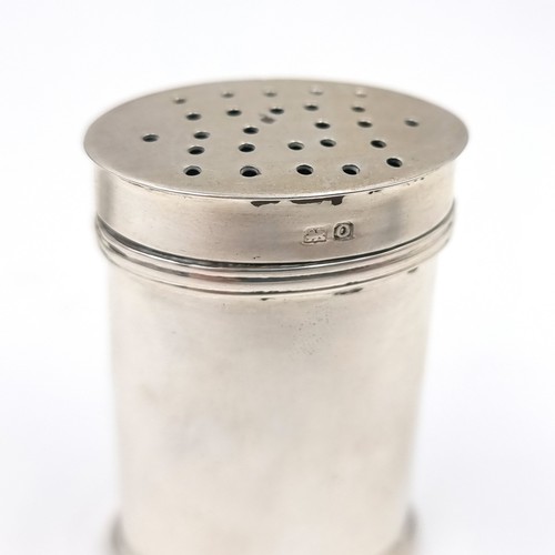 7 - A pretty sterling silver pepper cannister hallmarked Birmingham. Dimensions: Lid - 3 x 2 cms. Height... 