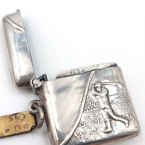 9 - A sterling silver vesta case with golfer design on front's piece. Hallmarked 925. Dimensions: 3.5 x ... 