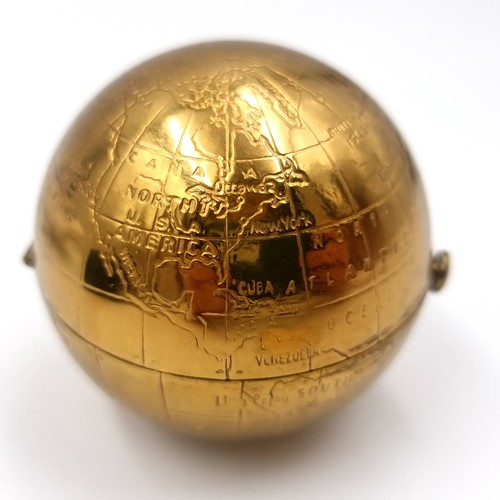 52 - An unusual vintage powder compact in the form of a world globe. Comes with original pouch.