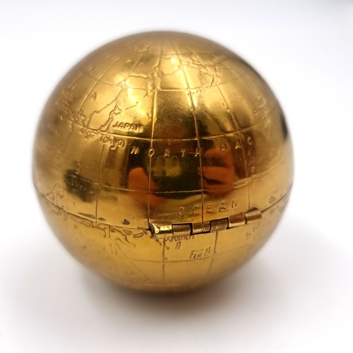 52 - An unusual vintage powder compact in the form of a world globe. Comes with original pouch.