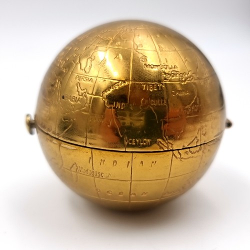 52 - An unusual vintage powder compact in the form of a world globe. Comes with original pouch.