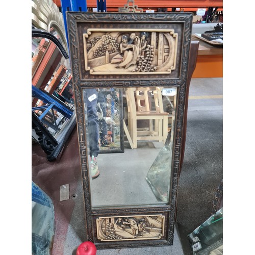 87 - Star Lot : An antique wooden relief carved beveled mirror featuring Chinese narratives.
MM: 34 x 33 ... 