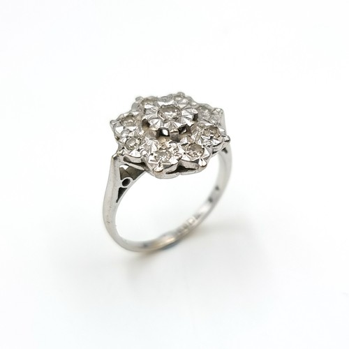 48 - Star Lot : A very nice example of a diamond cluster ring set in 18 carat white gold marked 750. Est.... 