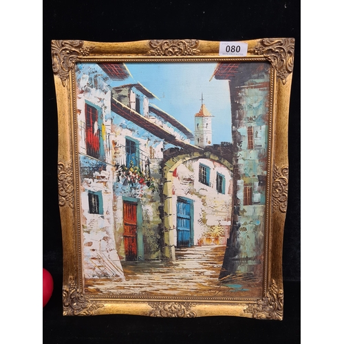 80 - A vibrant original oil on board painting featuring a Mediterranean town street. Rendered in a loose ... 