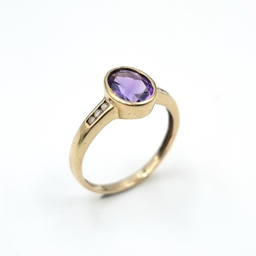 1 - Star Lot : A diamond and amethyst stone ring set in nine carat gold. Weight - 2.08 grams. Size - P. ... 