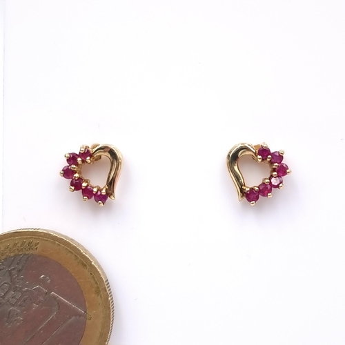 11 - Star Lot : A pair of very attractive nine carat gold natural ruby gem stones set stud earrings. Weig... 