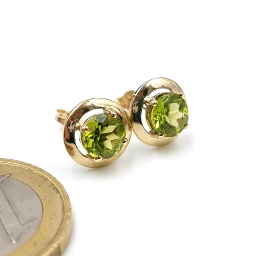 12 - A pair of very handsome nine carat gold large peridot stud earrings. Weight - 1.43 grams.