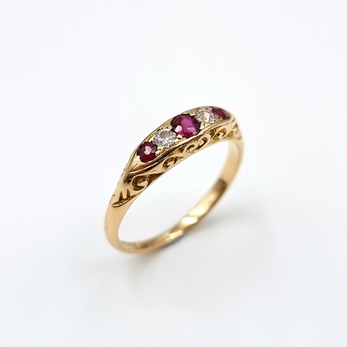 13 - Star Lot : An attractive five stone diamond and ruby set ring mounted in 18 carat gold. Size - N. We... 