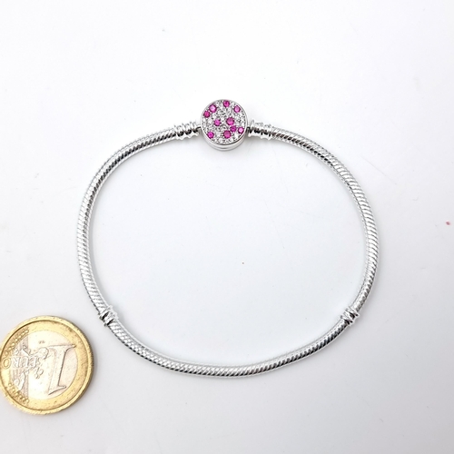 18 - A sterling silver bracelet with pink gemstone clasp. Weight - 13.6 grams. Old new stock.