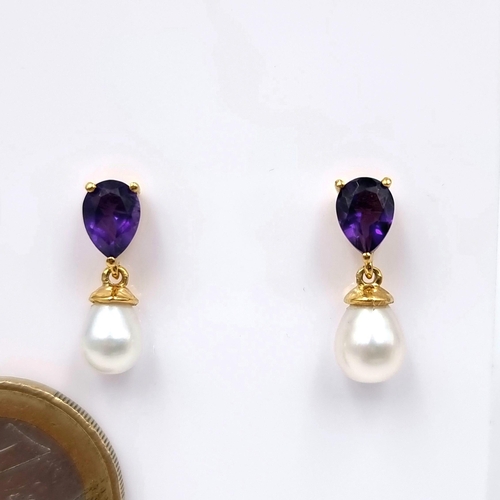 32 - A pretty pair of Sterling silver and 14 carat gold plated earrings set with lovely  amethyst and fre... 