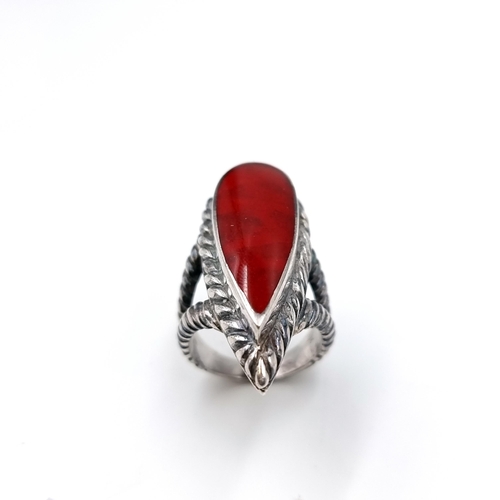 33 - A nice example of an unusual teardrop shaped red agate polished stone ring set in an attractive silv... 