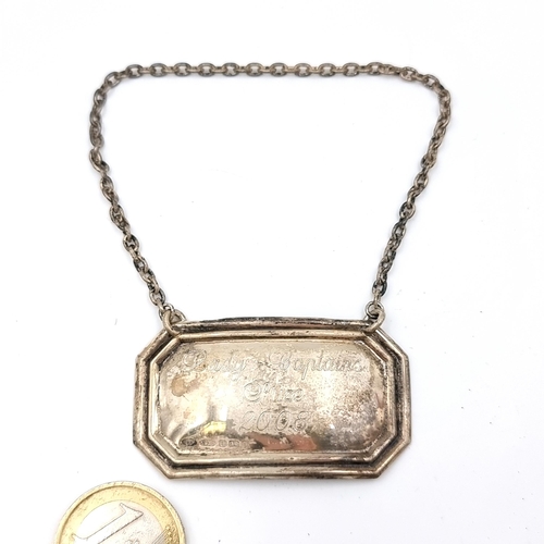 46 - A sterling silver decanted label dated 2008 with inscription. Total weight - 9.61 grams. As per phot... 