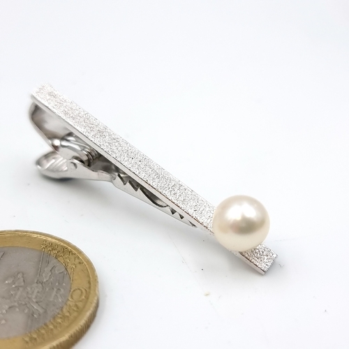 47 - A Taiyo Pearl tie pin marked sterling silver. Length - 4.5 cms. Weight - 4.7 grams. Comes in origina... 