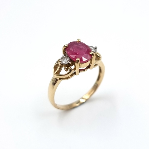 7 - Star Lot : A very attractive diamond and large Burmese ruby set ring mounted in nine carat gold. Wei... 