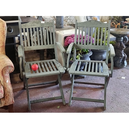 771 - A pair of robust 'Kingston' crafted furniture of high quality wooden garden chairs in a teal blue fi... 