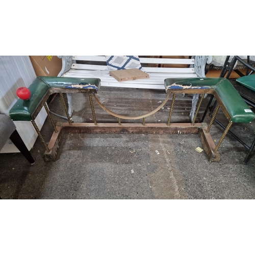 775 - Star lot : A super antique club fender bench featuring green leather surround with beaded detail. If... 