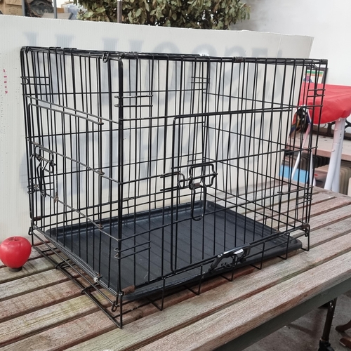 787 - A good sized metal animal travel crate to fit a small to medium sized dog. Very clean.