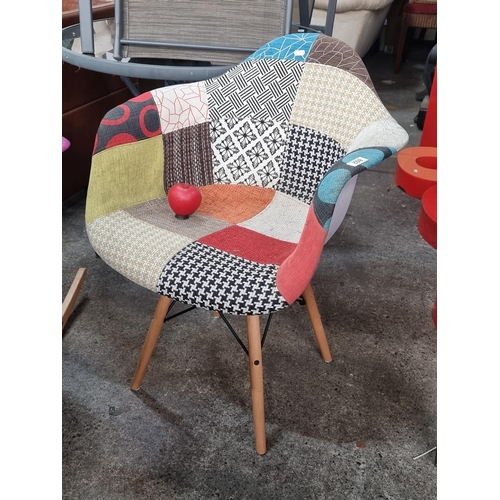 802 - A lovely patchwork upholstered chair with wooden legs and metal stretchers.