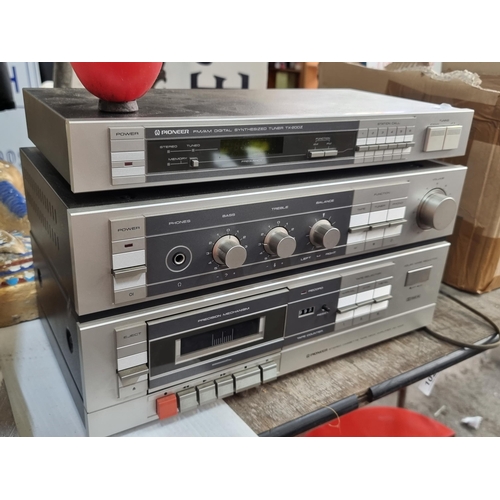 807 - A Pioneer TX 200-Z tuner along with a Pioneer Stereo Cassette Tape Deck Amp DC-100Z