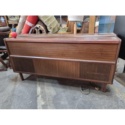 823 - A very cool 1960s vintage radiogram  music centre with concealed Garrard 2025 TC turntable along wit... 