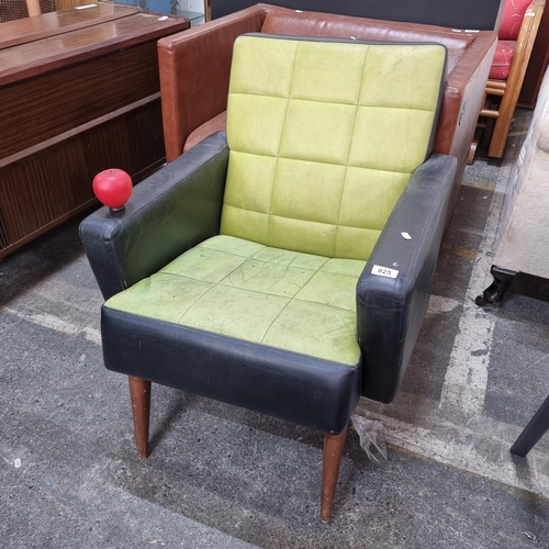 825 - A funky retro style leather armchair on tapered wooden legs in a black and lime green colourway