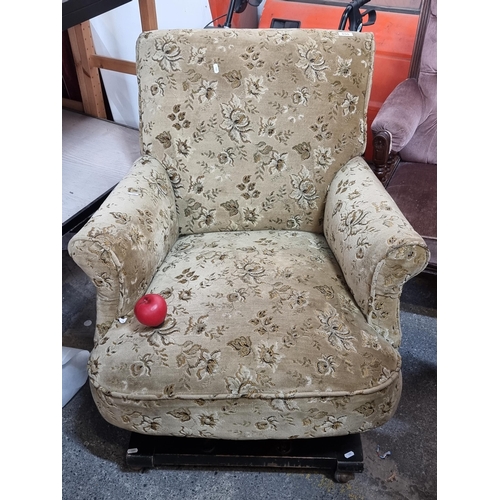 850 - A large comfortable vintage rocking chair on castor wheels upholstered in a lovely gold toned floral... 