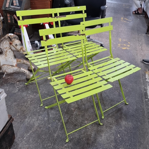 860 - Four lime green folding garden patio chairs