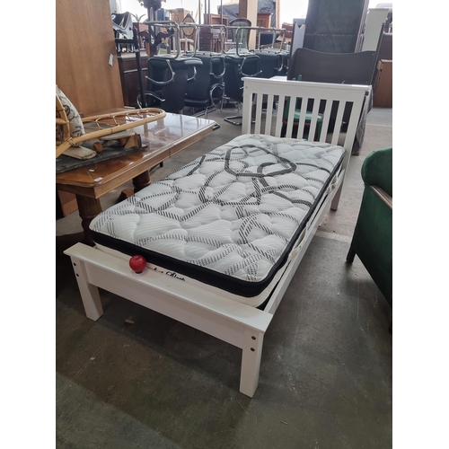 868 - Star Lot : A single pine bedframe with a white painted finish and slatted headboard along with a Com... 