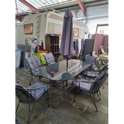 874 - Star Lot: A fantastic garden patio dining table set including six very sturdy metal chairs with padd... 