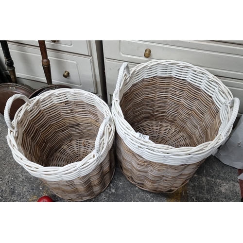 970 - A pair of woven wicker baskets with handles, featuring a two-tone design in natural and white.